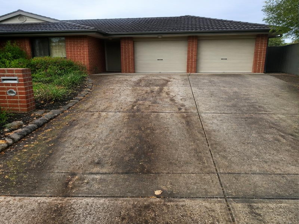Sydney concrete driveway stained with mould and traffic grime before cleaning
